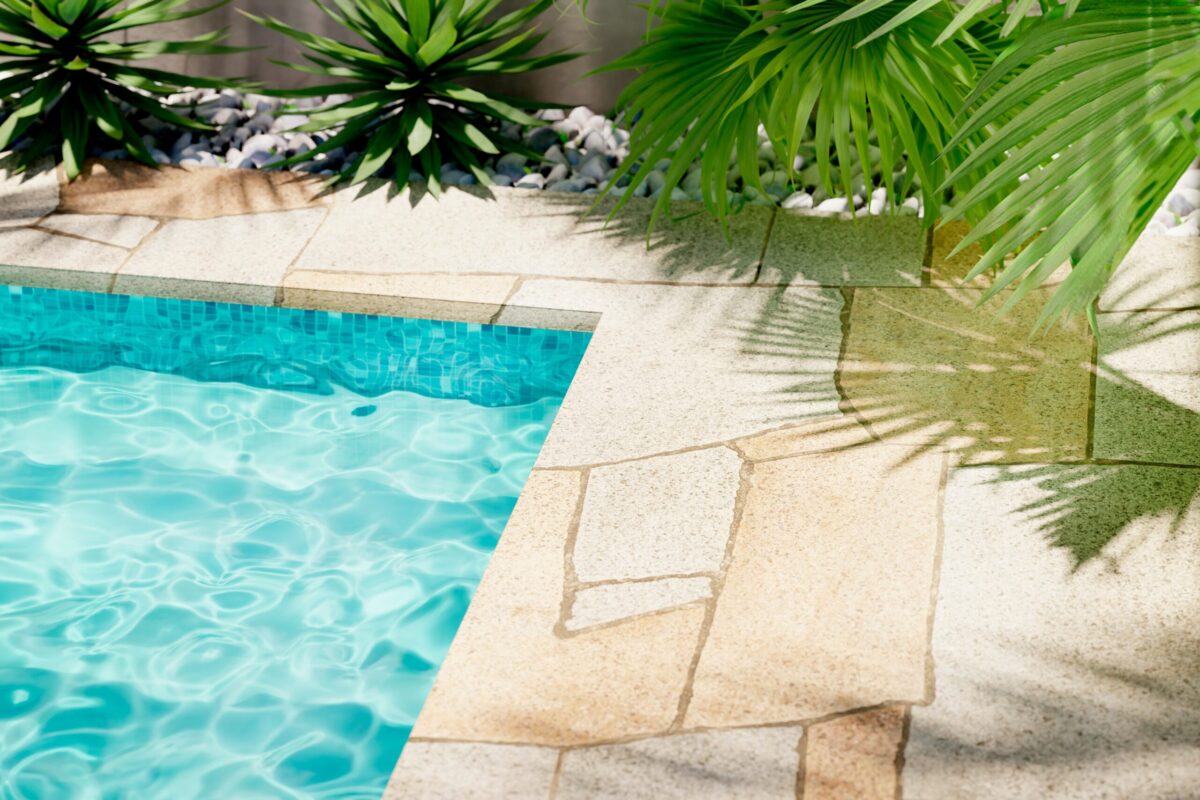 Luxury Swimming pool with stone tiles and palms surrounding